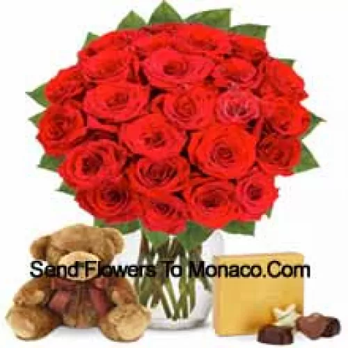 25 Red Roses With Some Ferns In A Glass Vase Accompanied With An Imported Box Of Chocolates