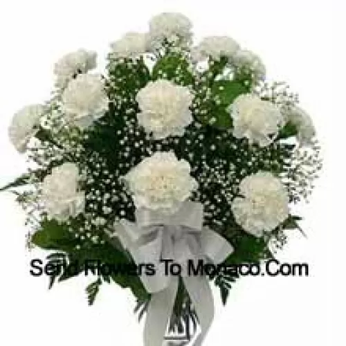 19 White Carnations With Seasonal Fillers In A Glass Vase