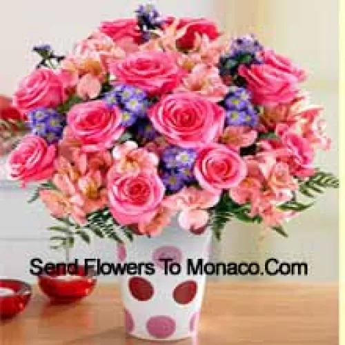 Pink Roses, Pink Orchids And Assorted Purple Flowers Arranged Beautifully In A Glass Vase