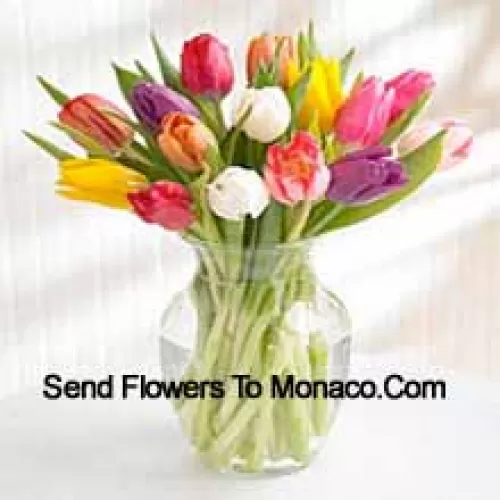 Mixed Colored Tulips In A Glass Vase - Please Note That In Case Of Non-Availability Of Certain Seasonal Flowers The Same Will Be Substituted With Other Flowers Of Same Value