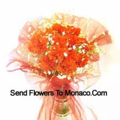 11 Orange Carnations With Some Ferns In A Vase