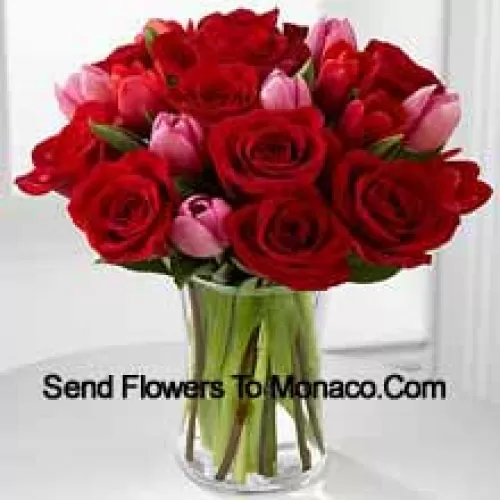 11 Red Roses And 6 Pink Tulips With Some Seasonal Fillers In A Glass Vase