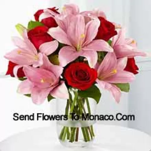 Red Roses And Pink Lilies With Seasonal Fillers In A Glass Vase