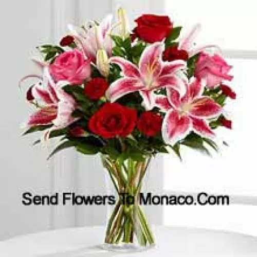 Red And Pink Roses With Pink Lilies And Seasonal Fillers In A Glass Vase