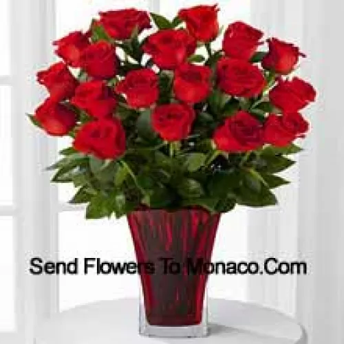 19 Red Roses With Seasonal Fillers In A Glass Vase Decorated With A Pink Bow