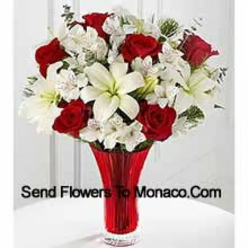 This Bouquet?is a gorgeous expression of yuletide joy and elegance. Red roses pop against a background of white Asiatic lilies and Peruvian lilies lovingly arranged in a red designer glass vase to create a bouquet of seasonal celebration. (Please Note That We Reserve The Right To Substitute Any Product With A Suitable Product Of Equal Value In Case Of Non-Availability Of A Certain Product)